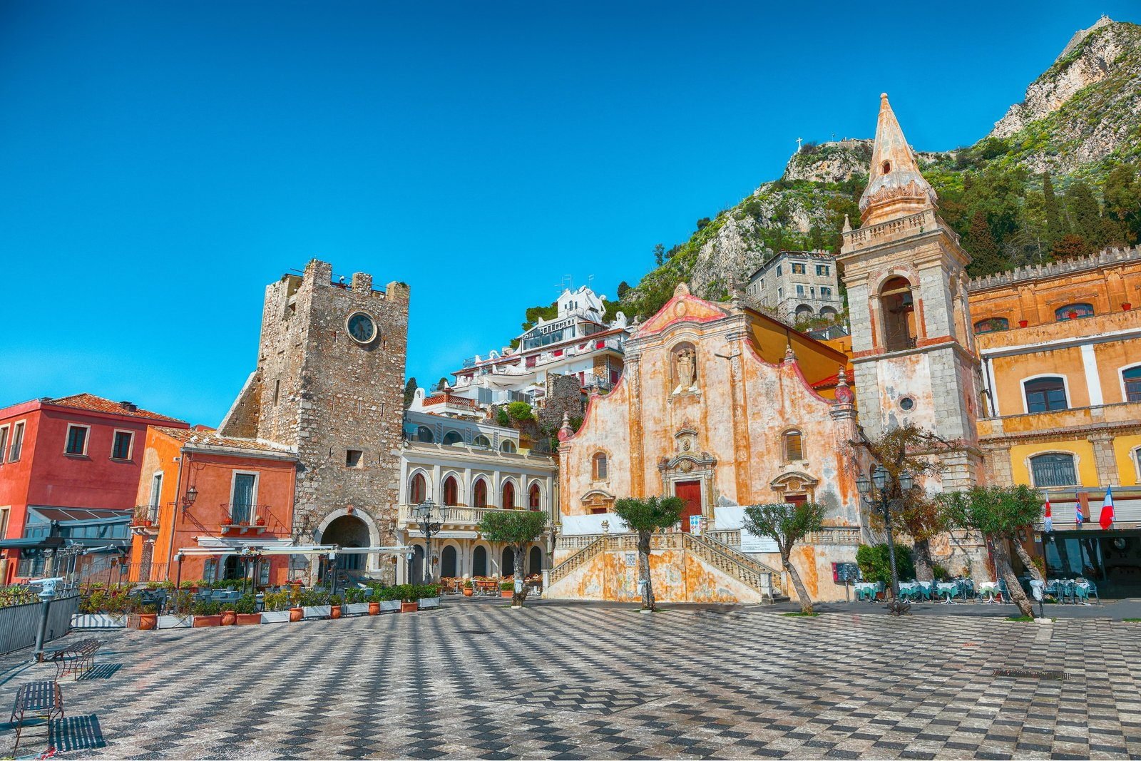 Piazza IX Aprile in Taormina, with its checkerboard paving, clock tower and baroque church