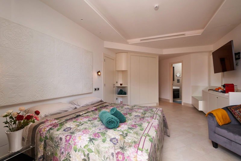The Deluxe Suite seen along its length, with the bathroom beyond