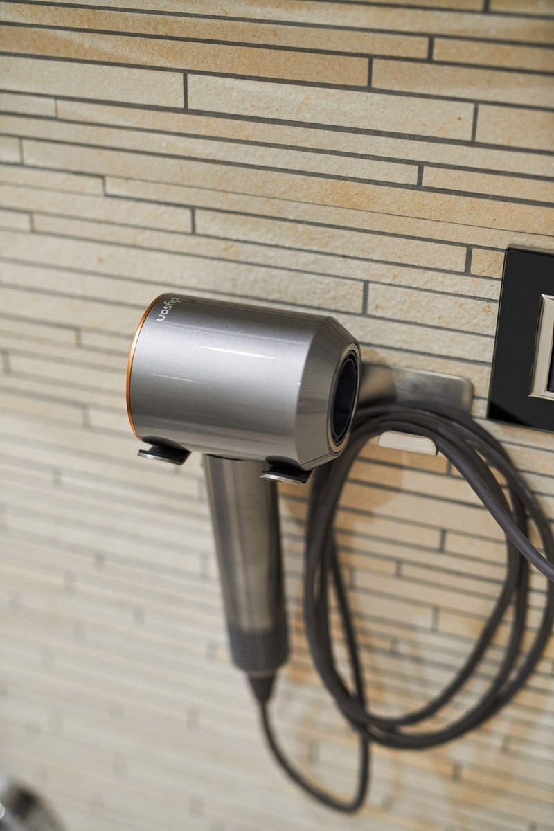 Dyson hairdryer mounted on the bathroom wall