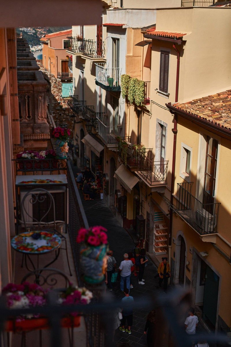 View from the suite balcony down a Taormina street towards the sea