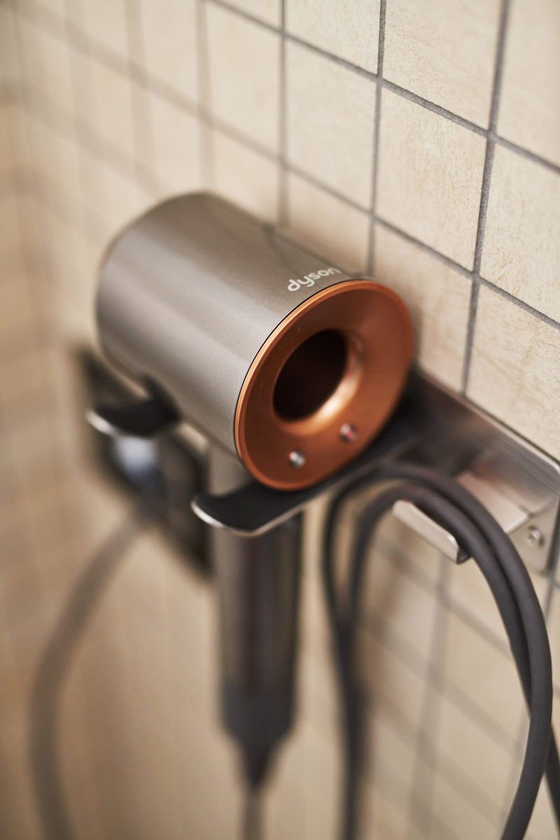 Dyson hairdryer on the bathroom wall