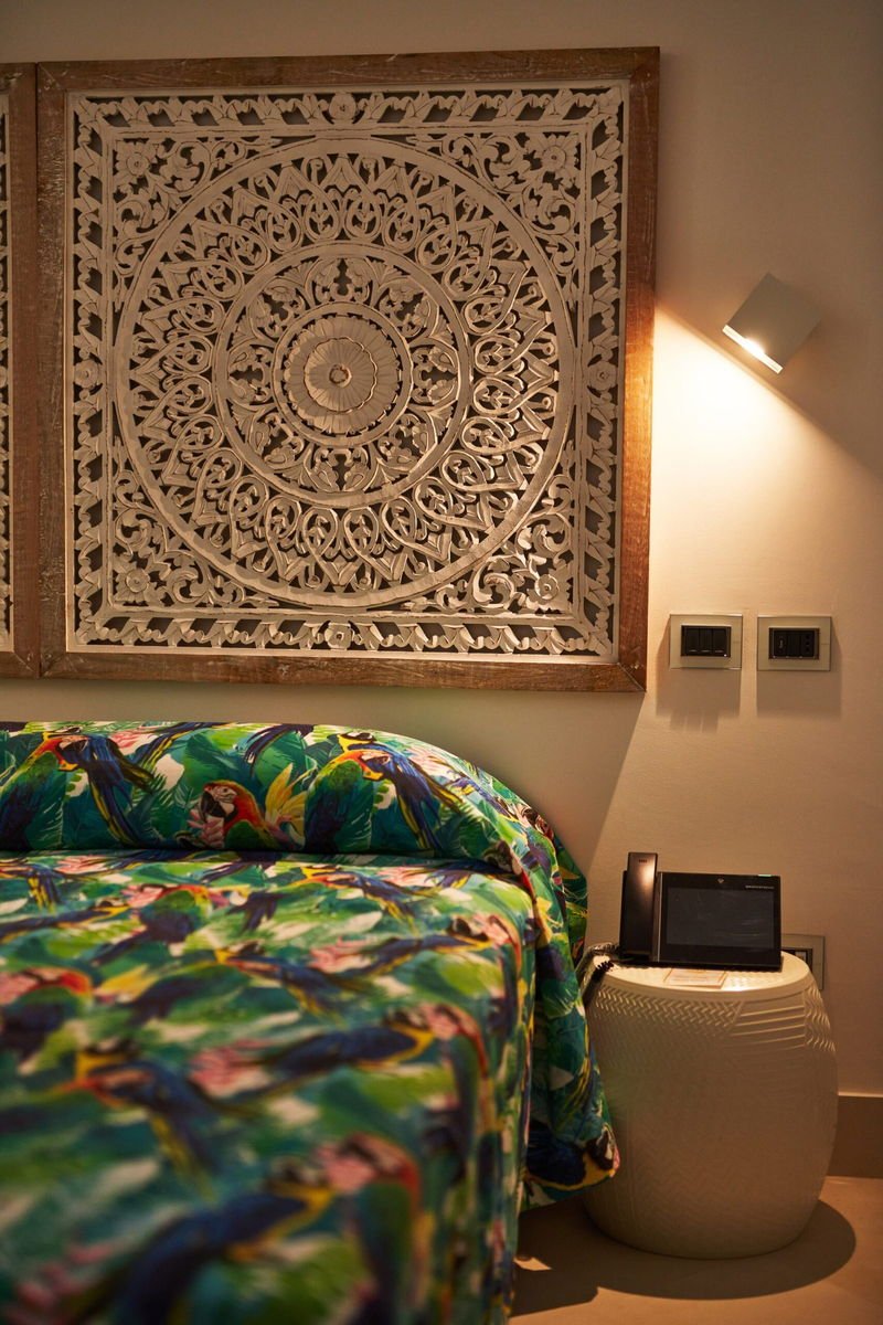 The King room lit by bedside lamps in the evening